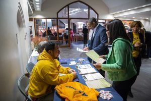 People visit a NAACP booth before a town hall meeting sponsored by Georgia Charter Schools Association and GeorgiaCAN at Ebenezer Baptist Church on Friday, Jan. 13, 2017, in Atlanta. (Branden Camp/AP Images for Georgia Charter Schools Association)