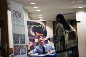 A man visits the GCSA booth before a town hall meeting sponsored by Georgia Charter Schools Association and GeorgiaCAN at Ebenezer Baptist Church on Friday, Jan. 13, 2017, in Atlanta. (Branden Camp/AP Images for Georgia Charter Schools Association)