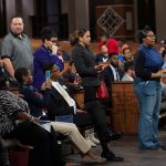 People line up to ask questions during a town hall meeting sponsored by Georgia Charter Schools Association and GeorgiaCAN at Ebenezer Baptist Church on Friday, Jan. 13, 2017, in Atlanta. (Branden Camp/AP Images for Georgia Charter Schools Association)