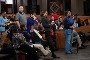 People line up to ask questions during a town hall meeting sponsored by Georgia Charter Schools Association and GeorgiaCAN at Ebenezer Baptist Church on Friday, Jan. 13, 2017, in Atlanta. (Branden Camp/AP Images for Georgia Charter Schools Association)