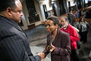 Journalist Roland S. Martin shakes a woman's hand following a town hall meeting sponsored by Georgia Charter Schools Association and GeorgiaCAN at Ebenezer Baptist Church on Friday, Jan. 13, 2017, in Atlanta. (Branden Camp/AP Images for Georgia Charter Schools Association)