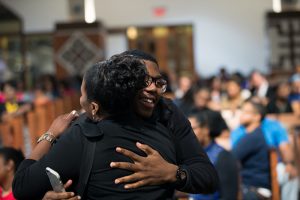 People embrace before a town hall meeting sponsored by Georgia Charter Schools Association and GeorgiaCAN at Ebenezer Baptist Church on Friday, Jan. 13, 2017, in Atlanta. (Branden Camp/AP Images for Georgia Charter Schools Association)