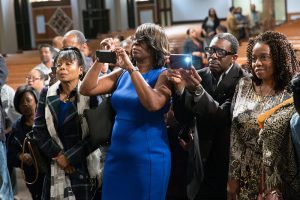 People take photos of the panelist following a town hall meeting sponsored by Georgia Charter Schools Association and GeorgiaCAN at Ebenezer Baptist Church on Friday, Jan. 13, 2017, in Atlanta. (Branden Camp/AP Images for Georgia Charter Schools Association)