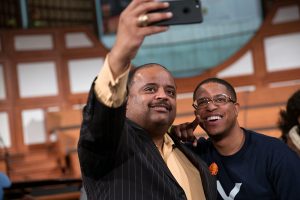 Journalist Roland S. Martin takes a photo with a man following a town hall meeting sponsored by Georgia Charter Schools Association and GeorgiaCAN at Ebenezer Baptist Church on Friday, Jan. 13, 2017, in Atlanta. (Branden Camp/AP Images for Georgia Charter Schools Association)