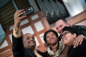 Journalist Roland S. Martin takes a photo with guest following a town hall meeting sponsored by Georgia Charter Schools Association and GeorgiaCAN at Ebenezer Baptist Church on Friday, Jan. 13, 2017, in Atlanta. (Branden Camp/AP Images for Georgia Charter Schools Association)