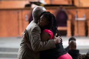 People embrace before a town hall meeting sponsored by Georgia Charter Schools Association and GeorgiaCAN at Ebenezer Baptist Church on Friday, Jan. 13, 2017, in Atlanta. (Branden Camp/AP Images for Georgia Charter Schools Association)